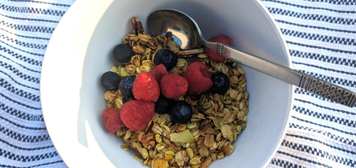 A bowl of homemade granola with fruit